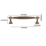 "Brass twisted fluted cabinet pull with antique finish"