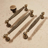 "Set of brass antique twisted fluted knobs and pulls"