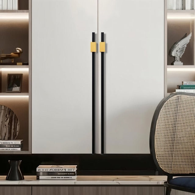 "Black and gold aluminum pull bars on a modern white wardrobe with open shelving."