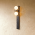 Two modern concrete wall sconces with stacked circular lights, shown front and side view against white background.