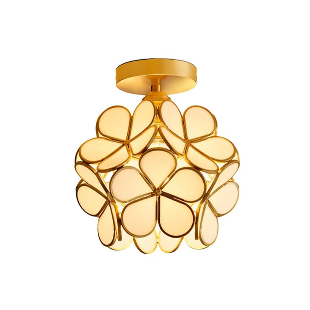 "A modern, floral-inspired ceiling light with a brass frame and luminous, ivory glass petals, providing a soft, elegant glow."