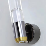 "Close-up detail of a modern wall lamp with a cylindrical acrylic diffuser and a sleek metal base."
