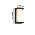 Black outdoor wall lamp with frosted glass, mounted vertically on white background.