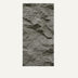 Textured gray concrete wall panel with rough, uneven surface finish.