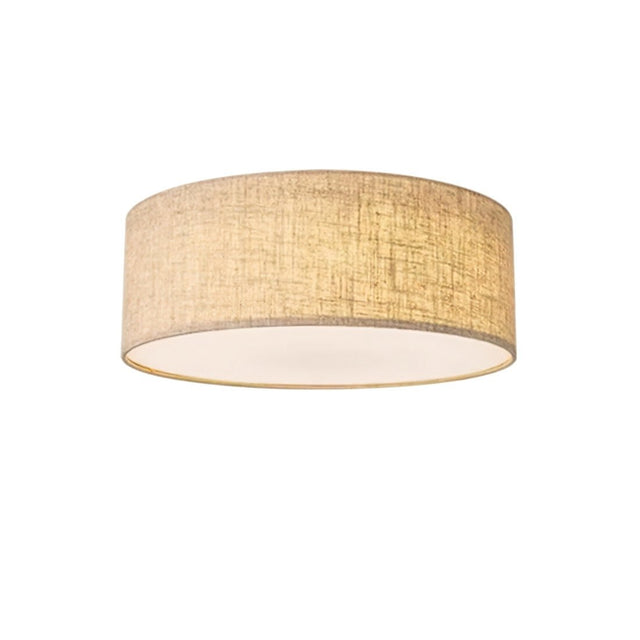 "Detailed view of a minimalist fabric drum ceiling light showcasing its texture and soft light diffusion."