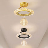 "Multiple ceiling lights with circular frames and hanging crystal spheres in gold, black, and white, shown against a blurred background."