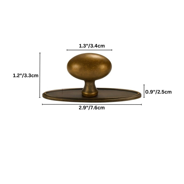 "Dimensions of an oval antique brass knob with a smooth, ergonomic grip, suitable for cabinets, drawers, and doors in traditional or modern interiors."