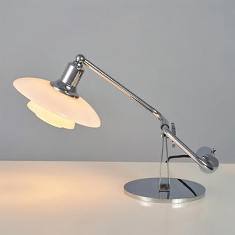 "modern table lamp with adjustable arm and polished chrome finish, featuring a diffused glass shade, crafted from aluminum and iron for durability"