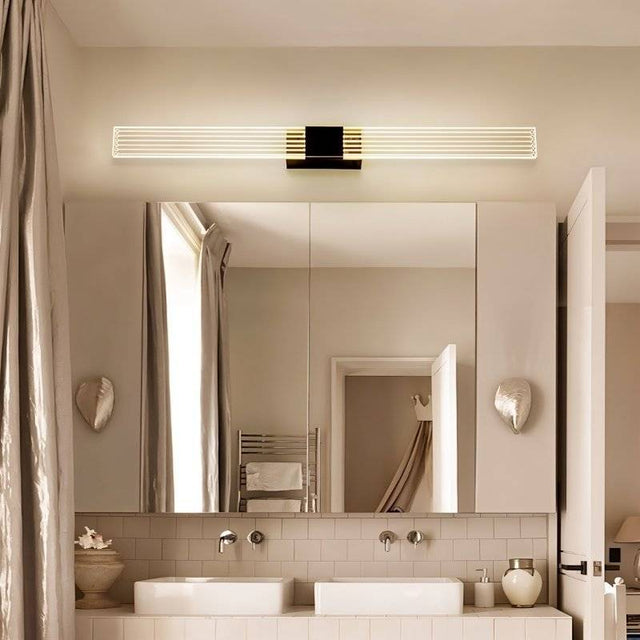 "Modern bathroom vanity light with a sleek design above a double sink and mirror."