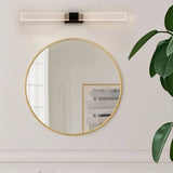 "Modern bathroom vanity light with gold accents and a linear design above a round mirror."
