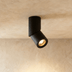 Two cylindrical light fixtures with white finish shown from front and angled views against white background with dimensions l