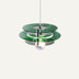Green glass pendant light with chrome metal hardware hanging against a light background.