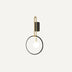 Modern wall lamp with brass curved arm, black metal circular shade, and white globe bulb on neutral background.