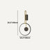Modern wall lamp with brass curved arm and black circular shade on light background.