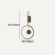 Modern wall lamp with brass curved arm and black circular shade on light background.