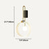 Modern wall lamp with brass and black metal frame and frosted glass circular shade on neutral background.