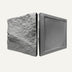 Two-piece decorative wall panel with textured stone finish and smooth dark frame on neutral background.