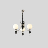  "Modern chandelier with three frosted glass globes, curved arms, and black detailing, isolated on a white background."