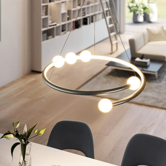 "Modern chandelier with curved arms and minimalist bulb holders in a contemporary dining room setting."