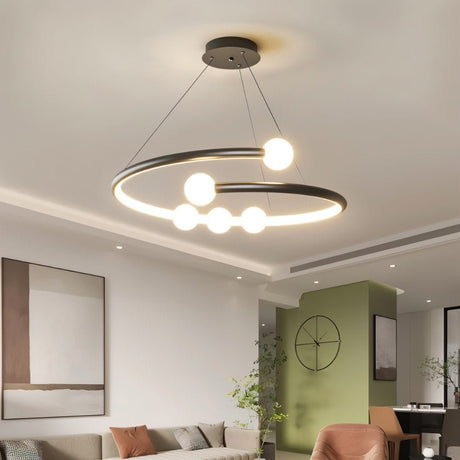 "Modern chandelier with a circular design and minimalist bulb holders illuminating a contemporary living room."
