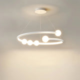 "Modern, white circular chandelier with minimalist bulb holders suspended from thin cables."