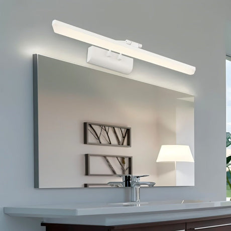 "A white LED vanity light mounted above a bathroom mirror with a sink, faucet, and artwork reflection."