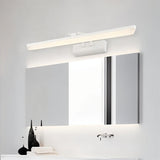 "A white LED vanity light mounted above a modern bathroom mirror with a white countertop and decorative objects."