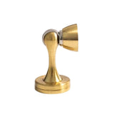 "Sleek, brass-finished zinc-alloy magnetic door stop with a contoured design, designed to prevent door slams and wall damage in modern interiors."