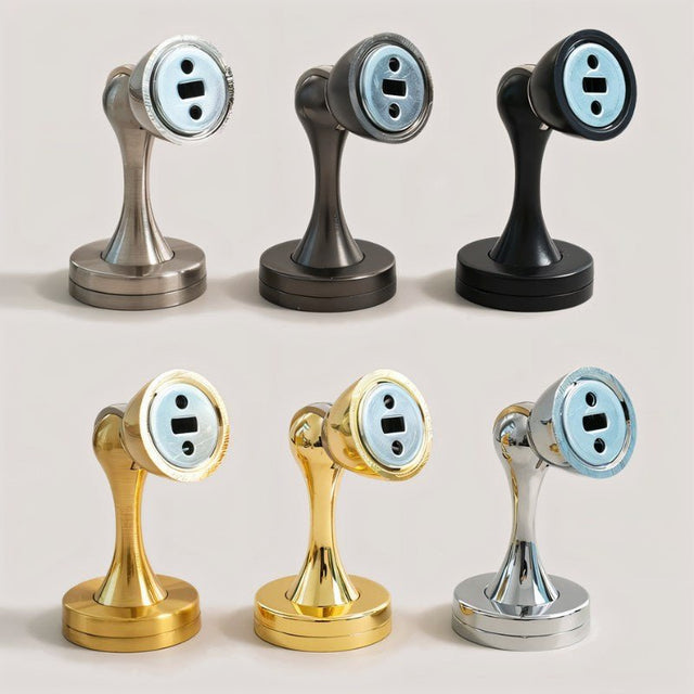 "Collection of sleek, zinc-alloy magnetic door stops with contoured designs in various finishes, including brushed nickel, gunmetal, black, gold, and chrome, designed to prevent door slams and wall damage in modern interiors."