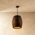 Barrel-shaped pendant light with metal bands, shown suspended from chain against white background, front view.