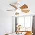Modern white and wood ceiling fan with integrated LED light installed above a dining table in a bright room.