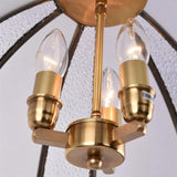 "Close-up of the Beal pendant light's fitting, showing three bulbs and the E14 marking."