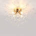 Gold ceiling light with cascading crystal strands and multiple warm bulbs against a white ceiling.