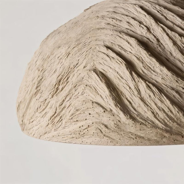 "Close-up detail of a Wabi Sabi cement pendant light, showcasing the raw textures and refined imperfections of the industrial cement finish."