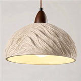 "Wabi Sabi cement pendant light with raw textures and a minimalist, industrial design."