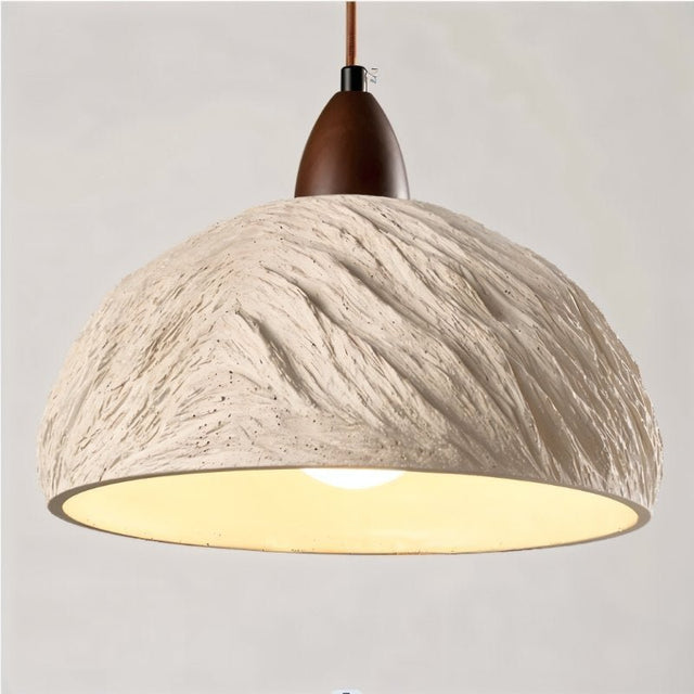 "Wabi Sabi cement pendant light with raw textures and a minimalist, industrial design."