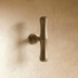 Brushed nickel bamboo-style cabinet pull with fluted barrel design, shown front view on white background with measurements.
