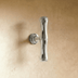 Bamboo-style cabinet pull with brushed nickel finish, front view on white background, 6.9 inches wide.