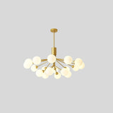 "A gold chandelier with 16 glass balls against a grey background."