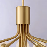 "Close-up detail of a gold chandelier with branching arms."