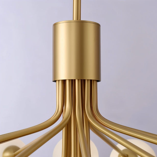 "Close-up detail of a gold chandelier with branching arms."