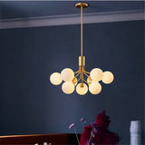 "A gold chandelier with glass balls in a dining room setting."
