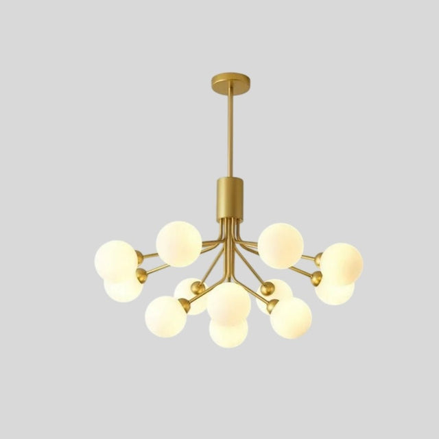 "10 heads gold chandelier with glass balls against a grey background."