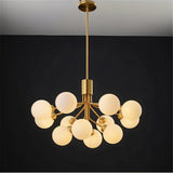 "A gold chandelier with glass balls viewed from directly below."