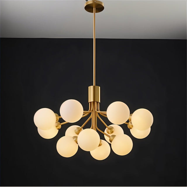 "A gold chandelier with glass balls viewed from directly below."