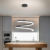 "Modern pendant light with a black spiral ribbon design over a kitchen island."