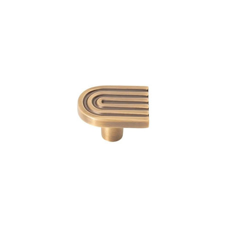 "Brass Art Deco cabinet knob with rounded edges and parallel lines."