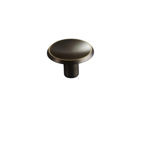 "Bronze brass circular knob with concave surface and chamfered edges, isolated on a white background."