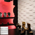 White textured 3D wall panels installed in modern retail display space with footwear and jewelry.