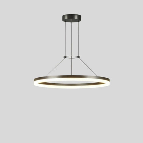 "A modern ring chandelier with a lit ring against a grey background."